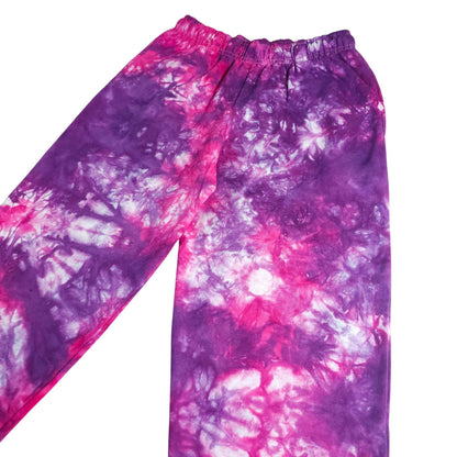 Purple and pink tie-dye jogger pants with elastic waistband and tapered legs