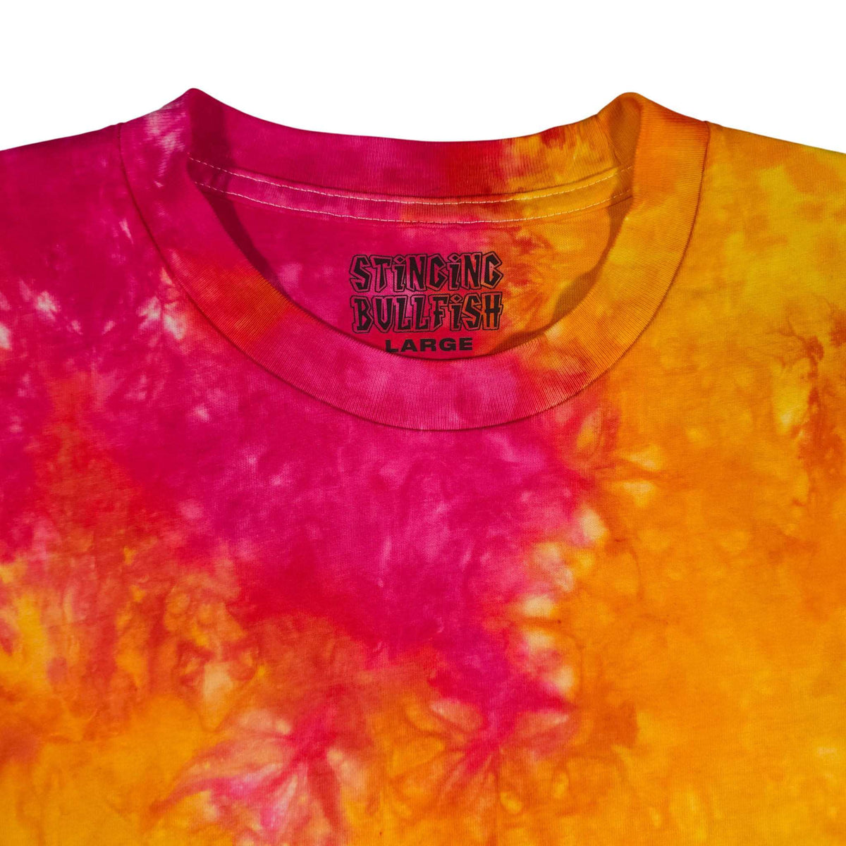 Tie-dye T-shirt with magenta and orange spiral pattern and small chest logo, crew neck.