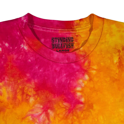 Tie-dye T-shirt with magenta and orange spiral pattern and small chest logo, crew neck.