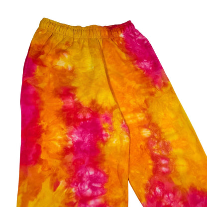 Tie-dye jogger pants with elastic waistband, orange and magenta swirls
