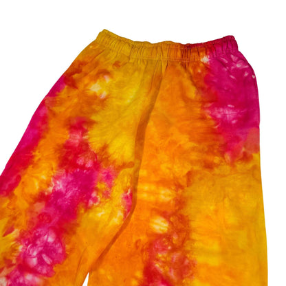 Tie-dye jogger pants in yellow-orange and magenta, elastic waistband