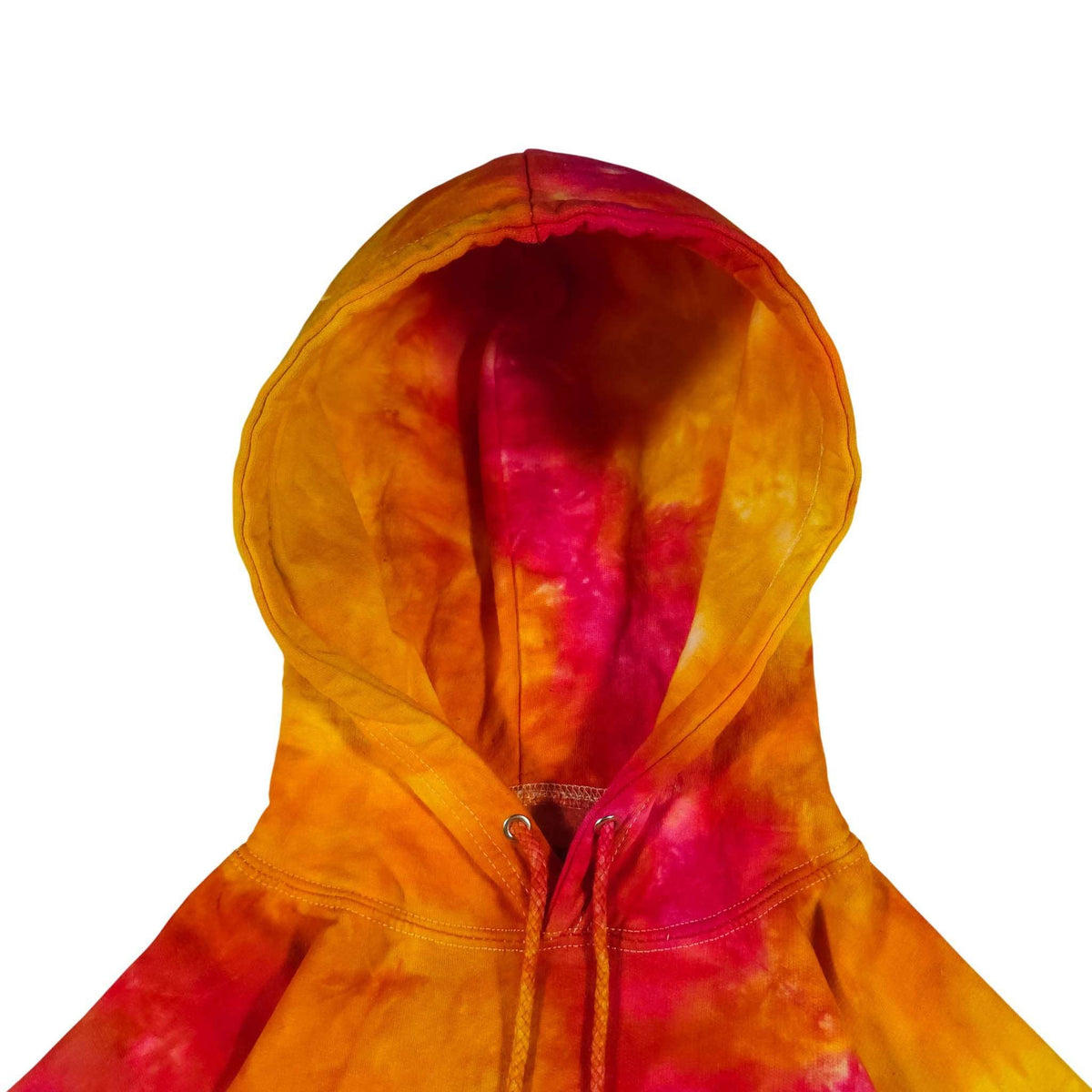 Tie-dye hoodie hood close-up with drawstring cords, orange and magenta