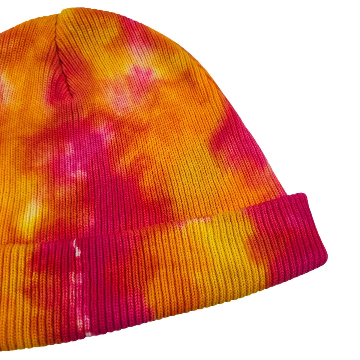 Tie-dye knit beanie hat with ribbed cuff and multicolor pattern
