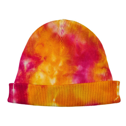 Orange and magenta tie-dye knit beanie hat with ribbed cuff