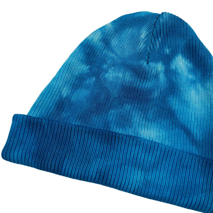 Blue tie-dye knit beanie with ribbed cuff, slanted side profile