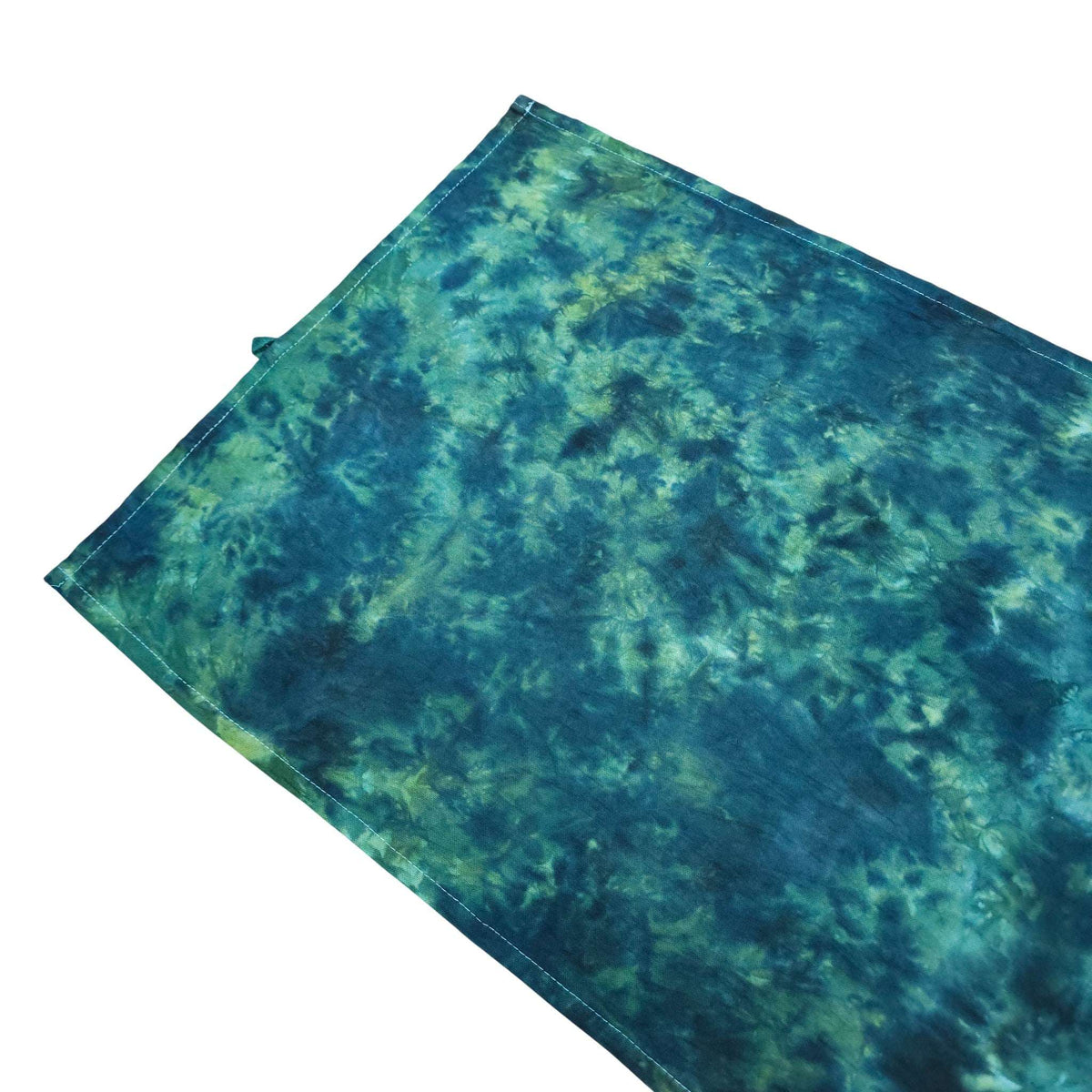 Teal and green tie-dye tea towel folded/stacked, rectangular stitched edge