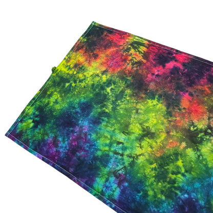 Tri-fold rainbow tie-dye tea towel, vibrant yellow-green, red, and deep blue