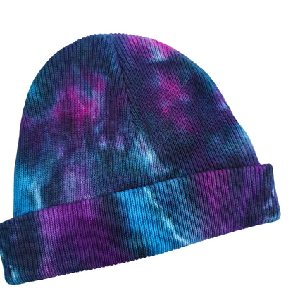Tie-dye beanie hat with folded cuff, blue and purple knit pattern