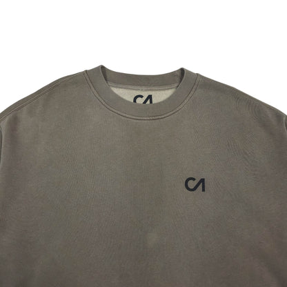 Charcoal crewneck sweatshirt close-up, small CA logo at center chest