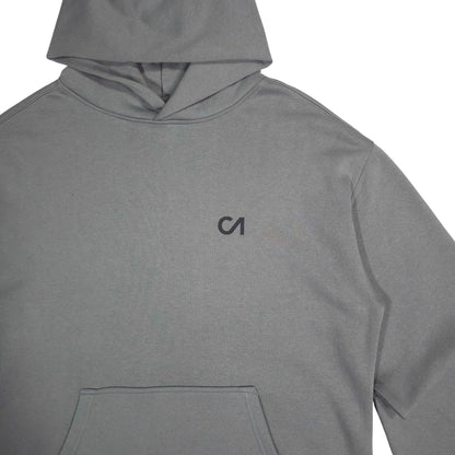 Grey pullover hoodie, chest logo and kangaroo pocket visible