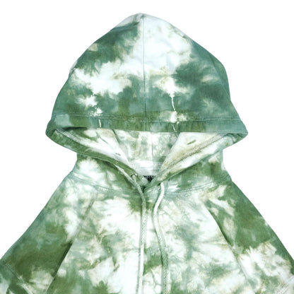 Tie-dye pullover hoodie close-up with hood lining and green drawstrings.
