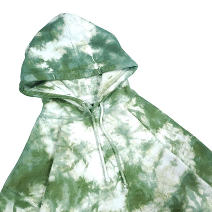Tie-dye pullover hoodie close-up with drawstring hood and ribbed cuffs.
