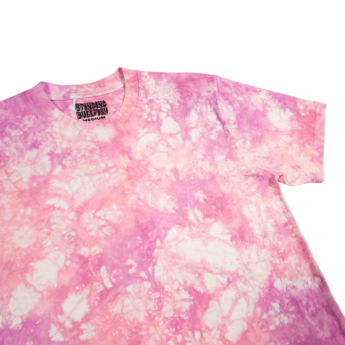 Pink tie-dye T-shirt from side angle, short sleeves and crew neck with logo.