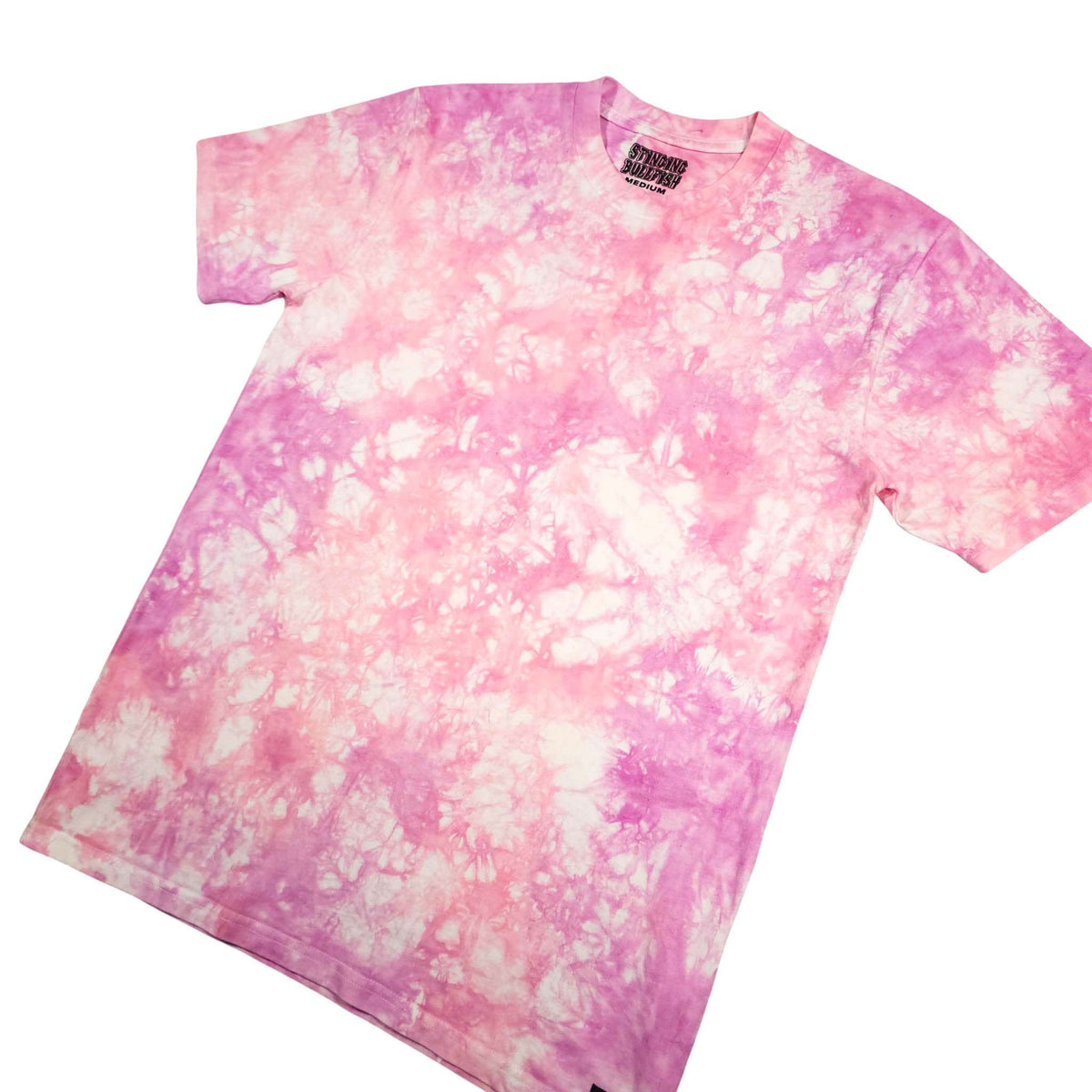 Pink tie-dye T-shirt on angled view with crew neck and short sleeves.
