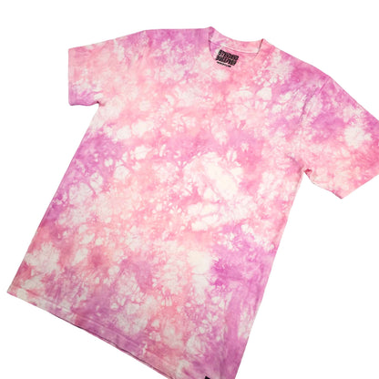 Pink tie-dye T-shirt on angled view with crew neck and short sleeves.