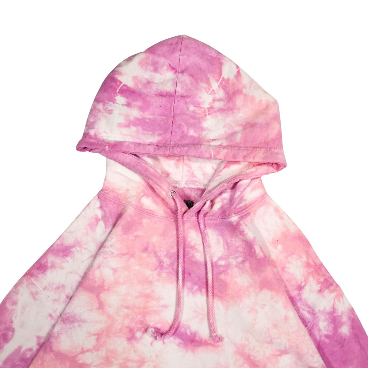 Pink tie-dye hoodie close-up of hood, drawstring and front kangaroo pocket.