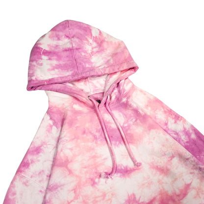 Pink tie-dye hoodie close-up of hood and drawstring with front seam.