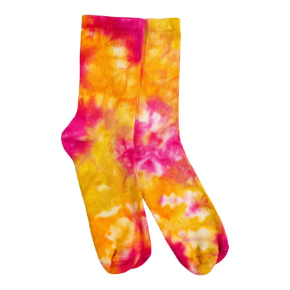 Pair of fruit salad tie-dye socks, colorful swirl pattern in pink and orange