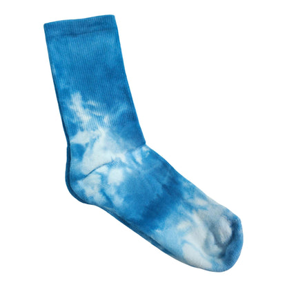 Blue tie-dye crew sock with vertical pattern and ribbed cuff