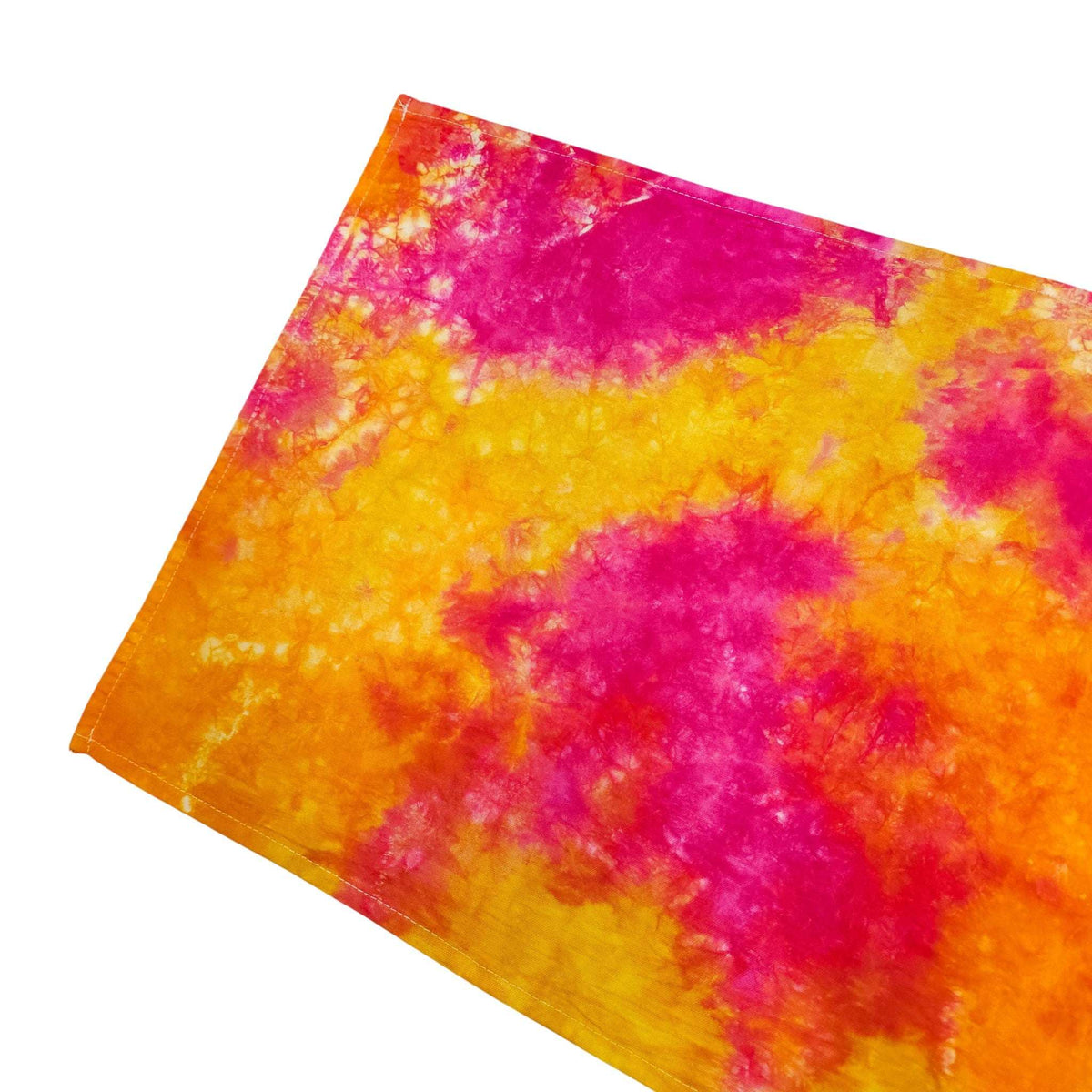 Tie-dye tea towel with vibrant pink, orange, and yellow cloud pattern