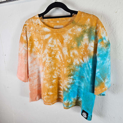 Orange, peach & blue tie-dye crop top on hanger, short sleeves and crew neck.
