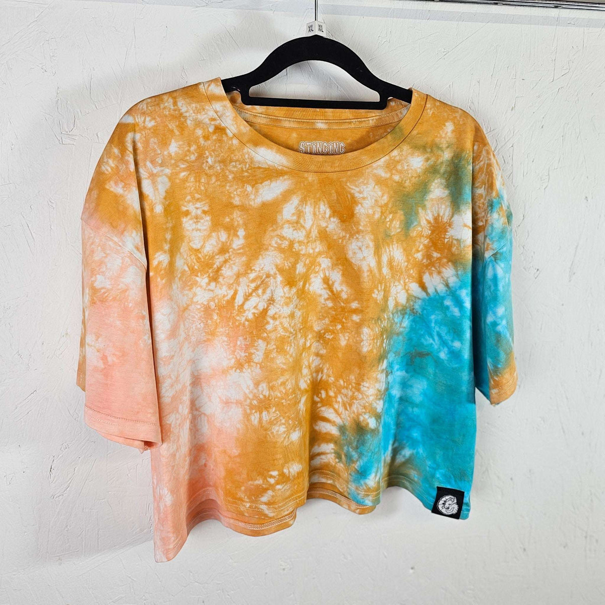 Orange, peach & blue tie-dye crop top, crew neck with short draped sleeves.