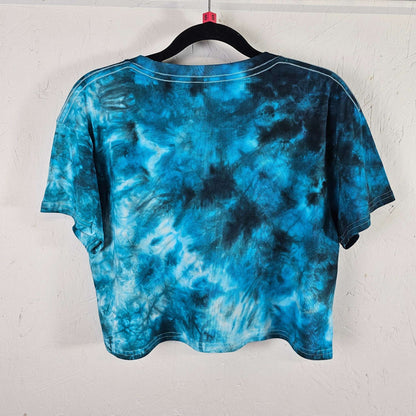 Back view of blue tie-dye crop top with short sleeves