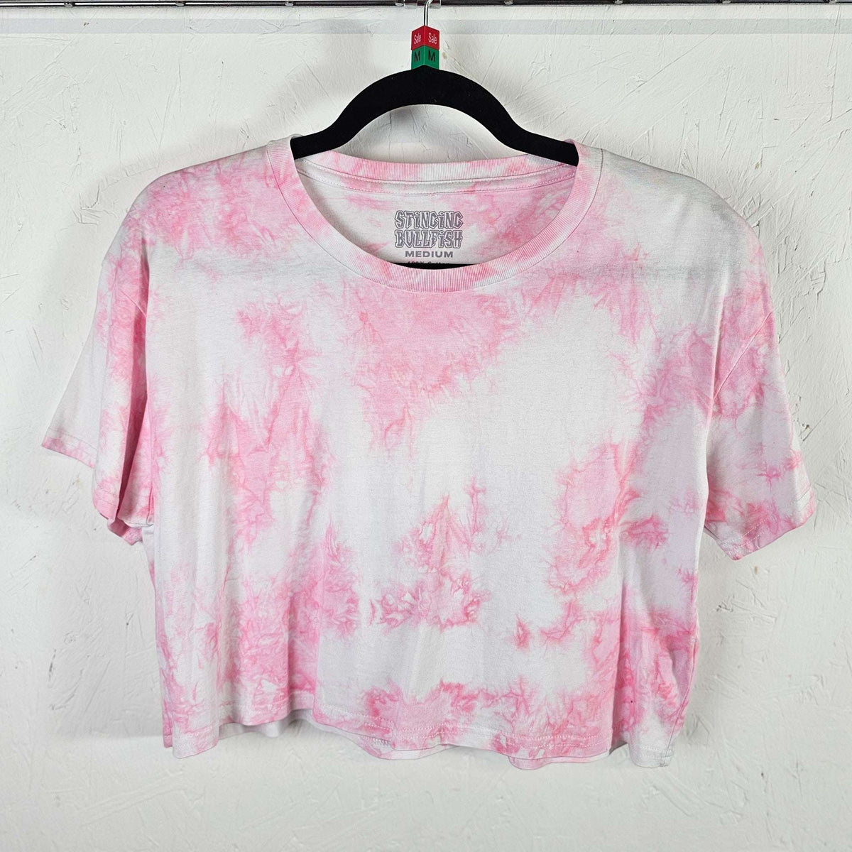 Pastel pink tie-dye crop top with crew neck and short sleeves
