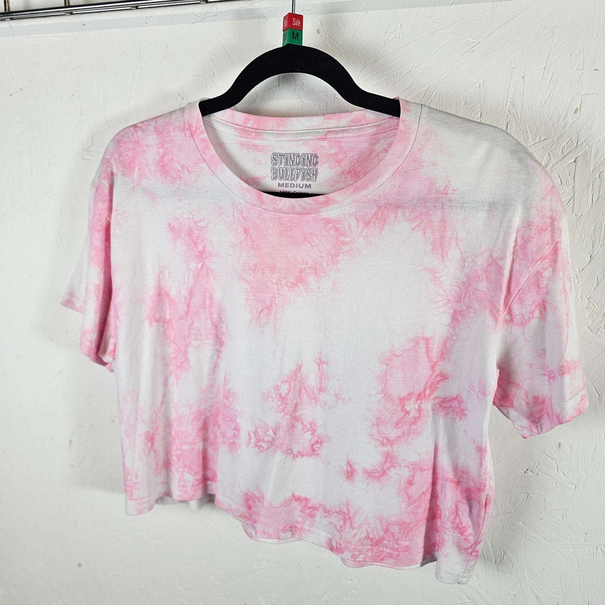 Pastel pink tie-dye crop top, crew neck short sleeves, draped front hem