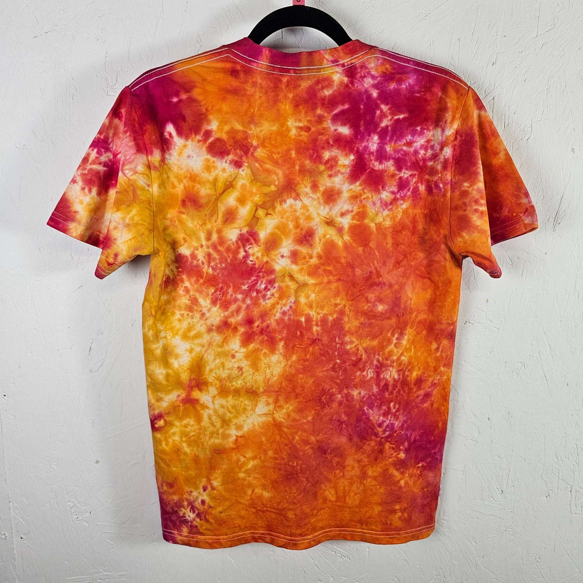 Fruit salad tie-dye t-shirt, multicolor back with orange, yellow, and burgundy swirls