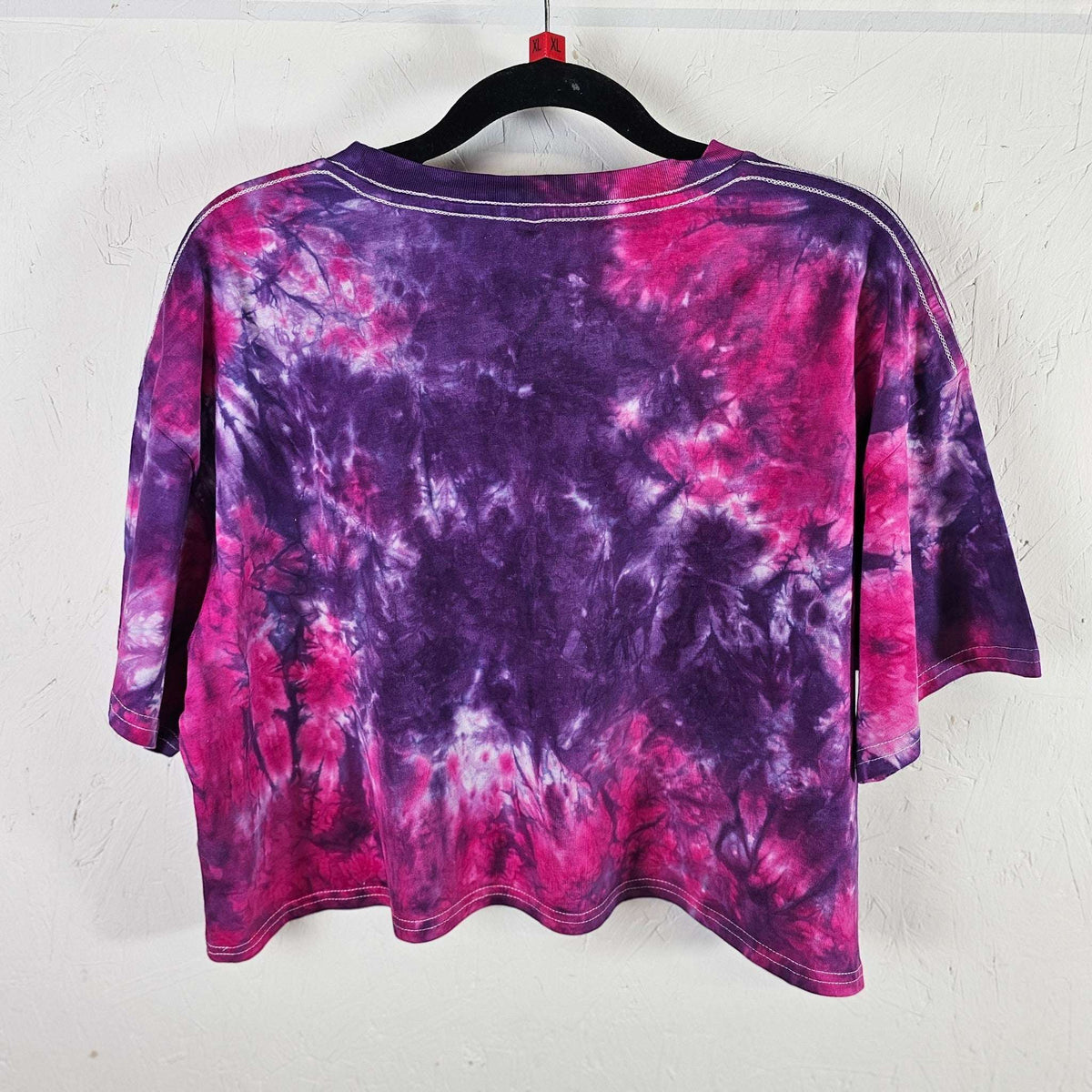 Purple and pink tie-dye crop top back view with crew neck and short sleeves