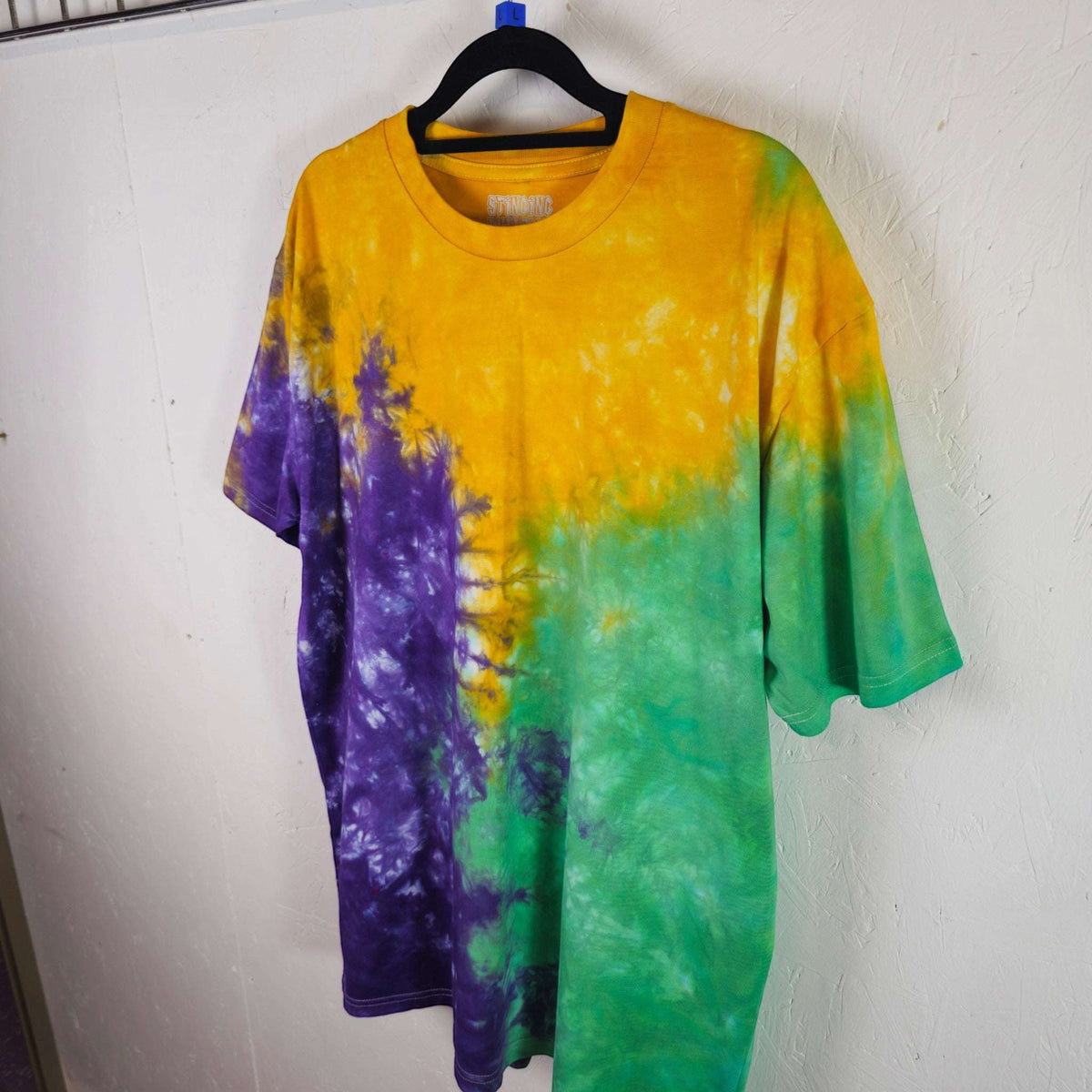 Tri-color tie-dye T-shirt in yellow, purple, and green, short-sleeve front view