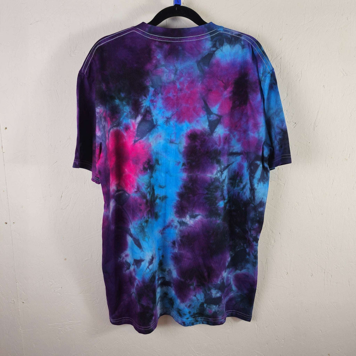 Nebula tie-dye T-shirt back view with purple, blue, and pink abstract pattern, crew neck