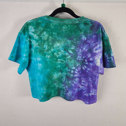 Tie-dye crop top with teal and purple swirl on back; short sleeves, crew neck.