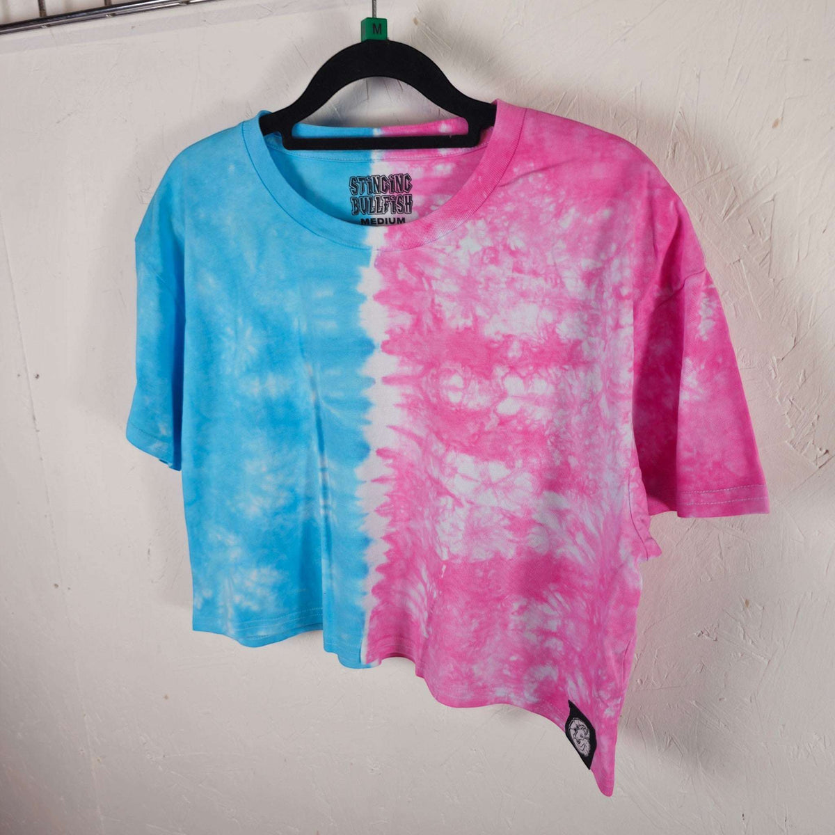 Split blue-and-pink tie-dye crop top, short sleeves, side logo patch