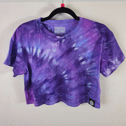 Purple tie-dye crop top with short sleeves and crew neck, swirl pattern