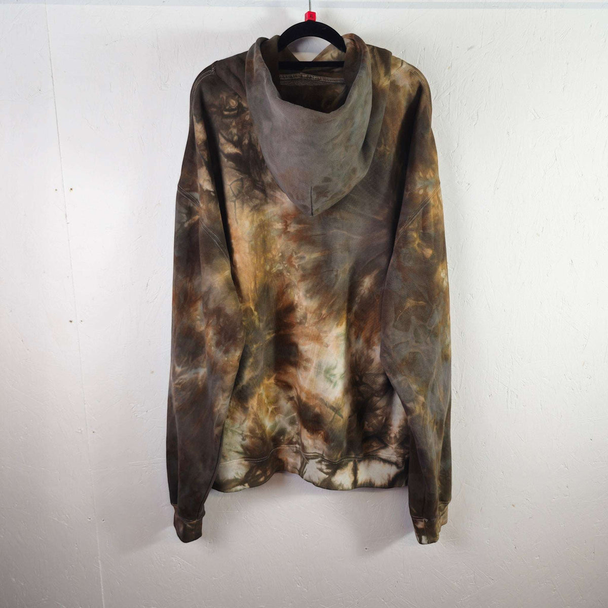 Oversized tie-dye hoodie with hood and front pocket, dark brown, tan, green blotches