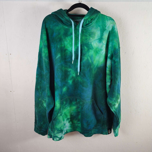 Oversized green-blue tie-dye hoodie with hood, white drawstrings, and front kangaroo pocket
