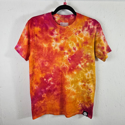 Tie-dye t-shirt with orange and pink patterns on a white background