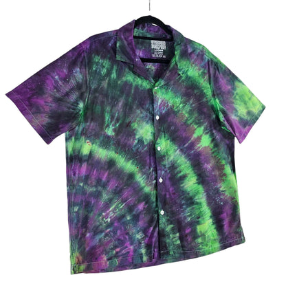 Tie-dye short-sleeve button-up shirt featuring purple and green swirl stripe pattern