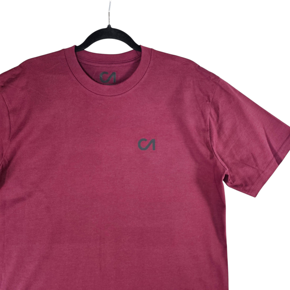 Berry maroon crew-neck T-shirt on a hanger with small chest logo