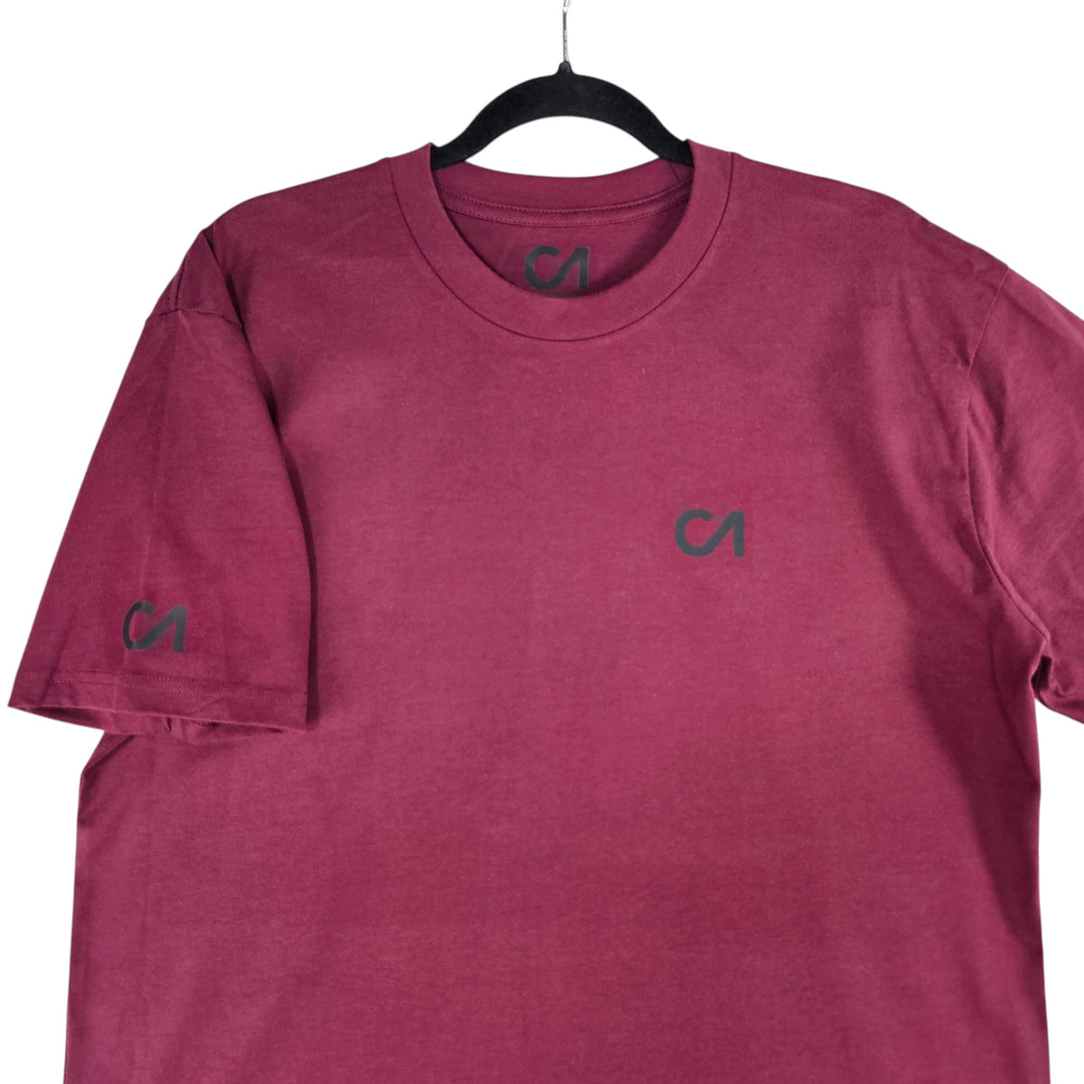 Berry maroon short-sleeve T-shirt with small chest logo and left sleeve logo