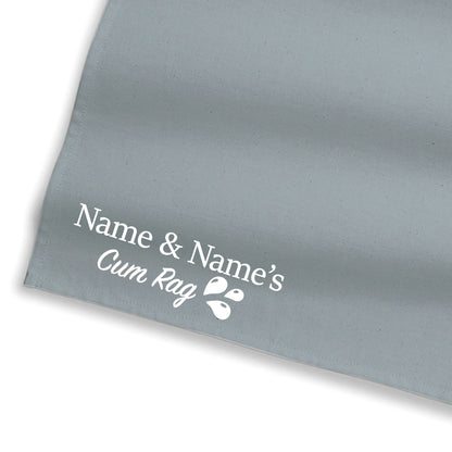 Light blue-gray personalized rag close-up with Name & Name's text and icon