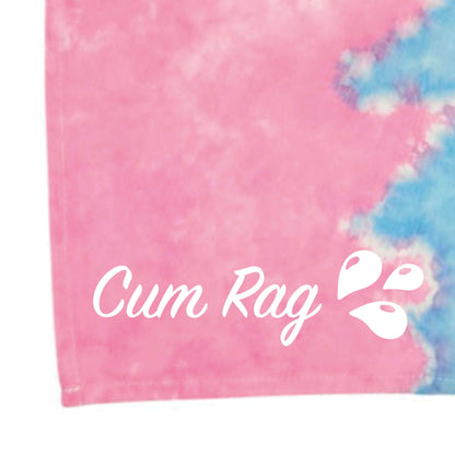Tie-dye rag close-up with pink fabric and light-blue edge contrast, stitched