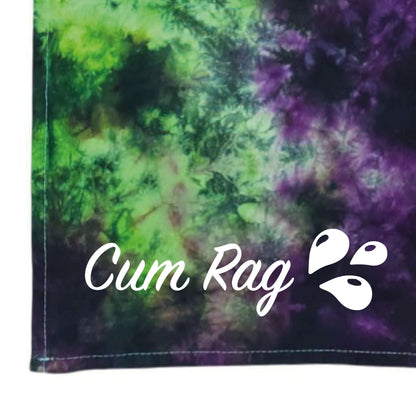 Tie-dye rag with green and purple swirled sections, stitched edges