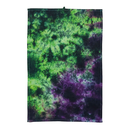 Tie-dye tea towel with green and purple swirls and dark stitched border