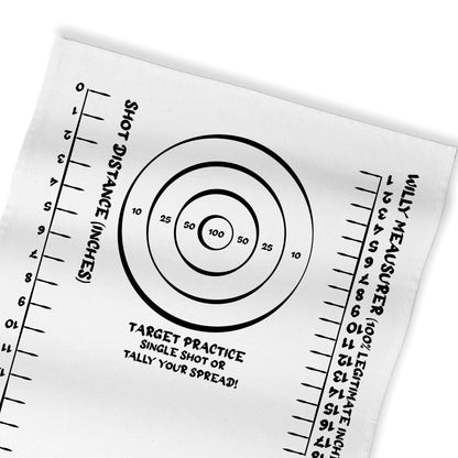 White target practice rag close-up with bullseye circles and ruler-style scale marks